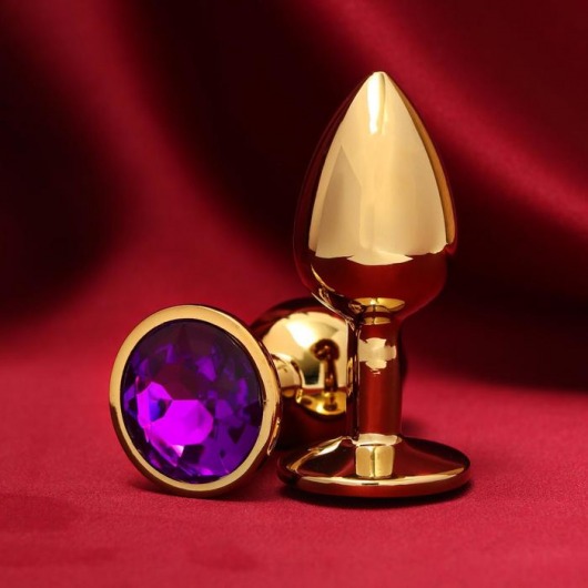 Золотистая анальная пробка с фиолетовым кристаллом - Сима-Ленд - купить с доставкой в Ростове-на-Дону
