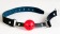 Красный пластиковый кляп-шар на чёрных кожаных ремешках - ToyFa - купить с доставкой в Ростове-на-Дону